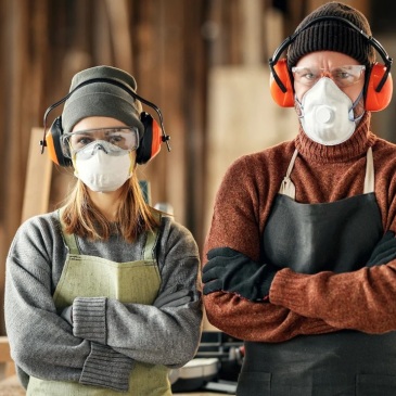 2 persons with quality ppe in a woodworking place